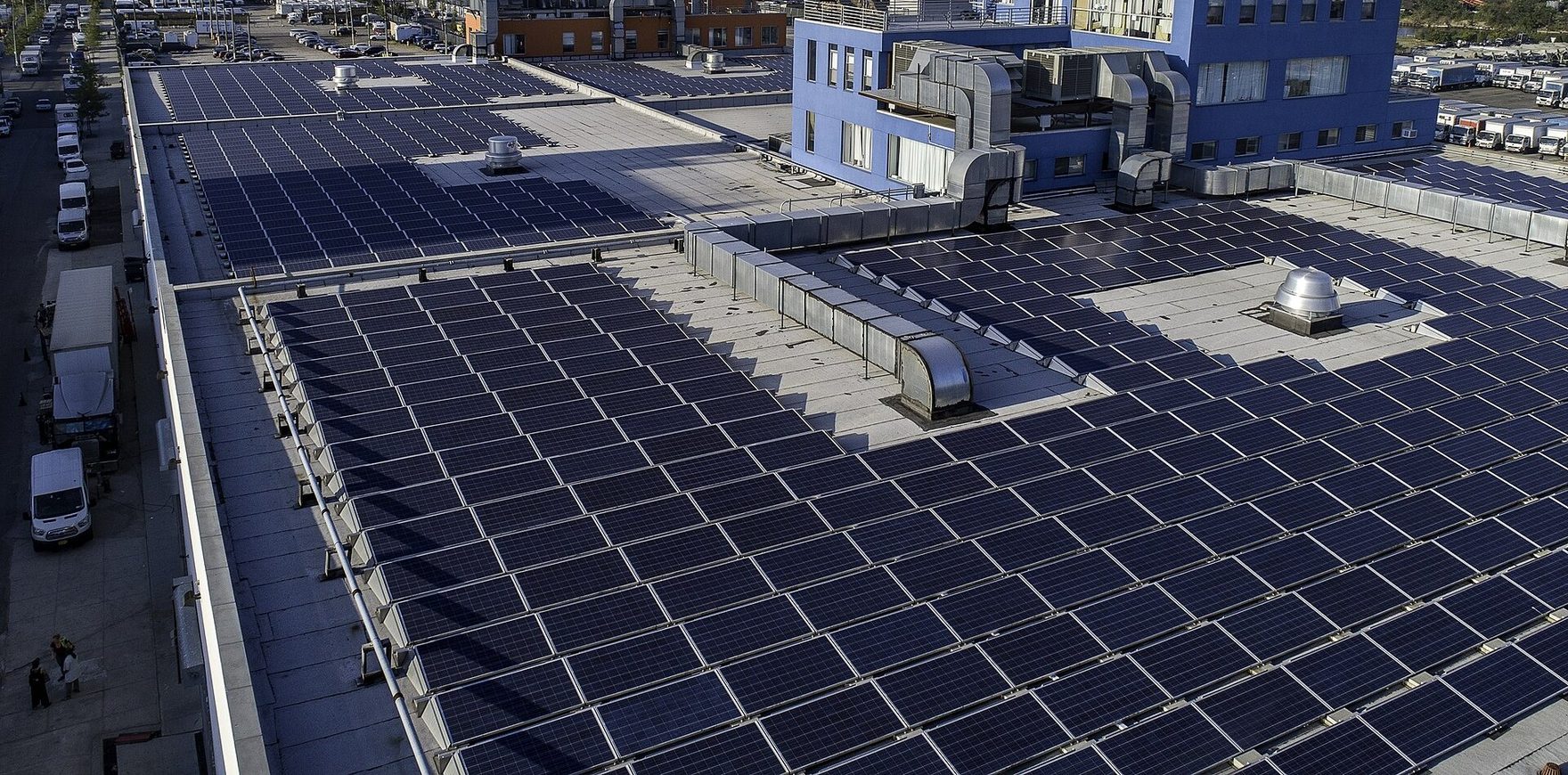 A large commercial rooftop covered edge-to-edge in solar panels